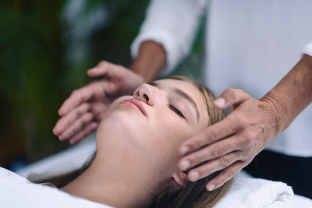 Reiki Healing Treatment With Teenage Girl